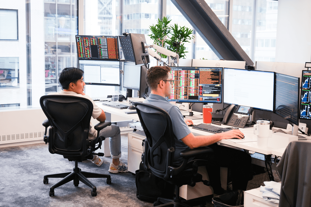 Corbets employees working in front of computer monitors